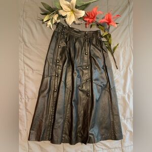 Women’s long black leather skirt, Lomonor creation from Paris France.